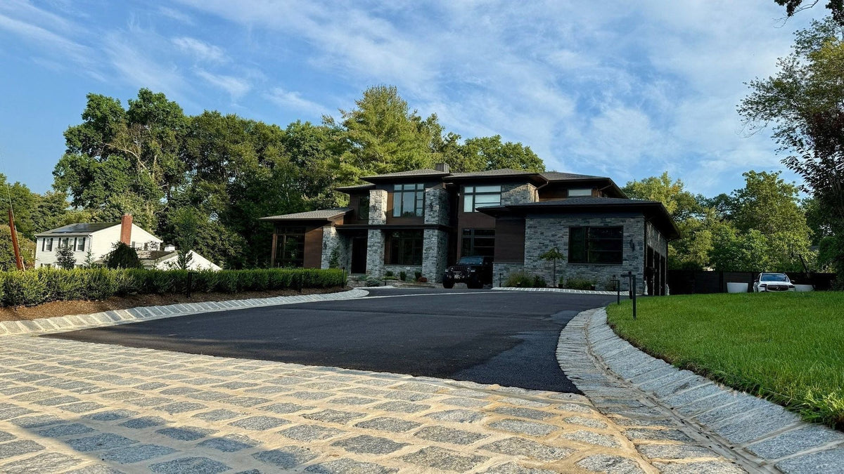 Modern home in Old Tappan, NJ, with a jumbo granite Belgian block driveway