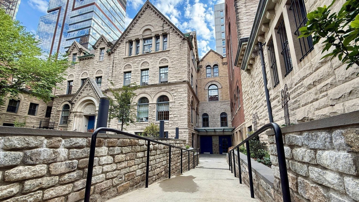 Stone walkway beside the historic stone buildings of St. Michael's Church on Manhattan's Upper West Side